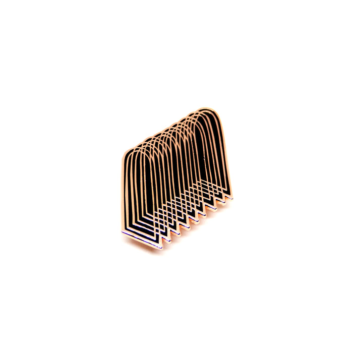 hard enamel pin of overlapping arches, copper colored intricate outlines on black 
